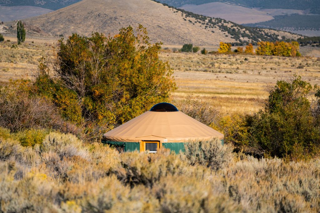 A shot of the Willow Glamping Yurt at Castle Rocks State Park and the surrounding scenic landscape.