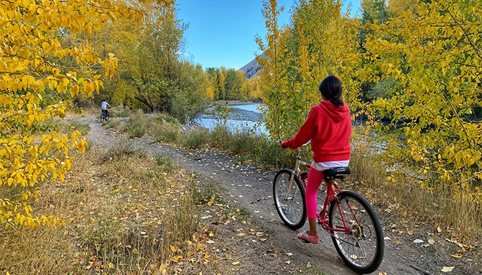 Biker in Hailey riding through fall foliage