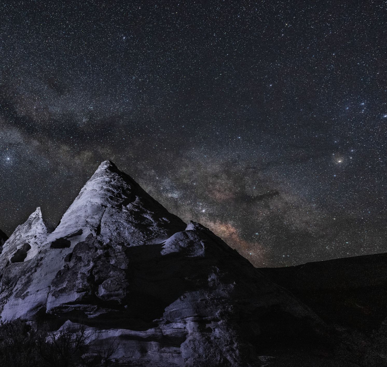 Dazzling night at Teepee Rocks, where a towering pillar meets the stars.