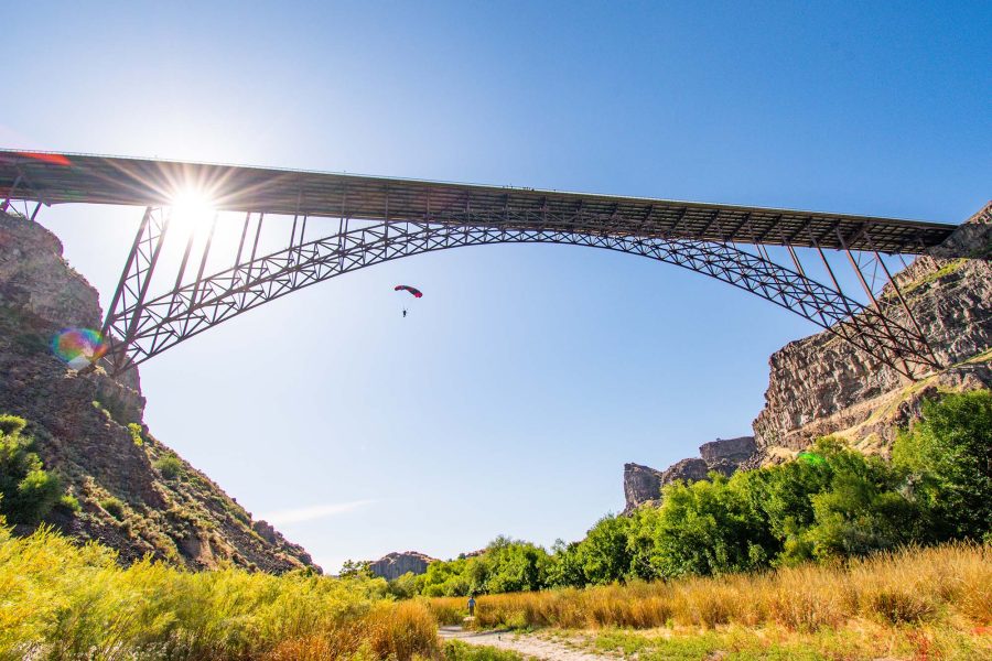 A BASE jumper soars through the sky at the Perrine Bridge.  