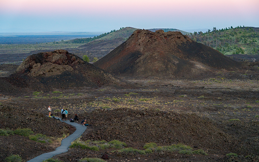 Visitors explore the volcanic landscape of Craters of the Moon National Monument in Southern Idaho.